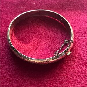925 sterling silver bangle, with etching, clap, and safety chain.